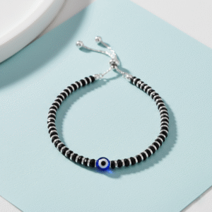 Adjustable Nazariya bracelet in pure silver with black beads with evil eye