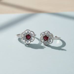 Toe ring in floral pattern with red gemstone in pure silver