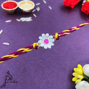 Pure silver flower rakhi with pink in the middle for brother in thread